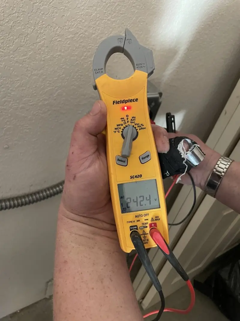 Voltage testing with clamp meter during Outlet Installation in Painesville